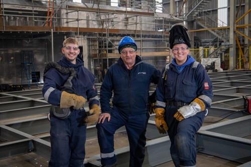 Casper Wilamowski third year apprentice, John McMunagle welding trainer, and Beth Atkinson third year apprentice.